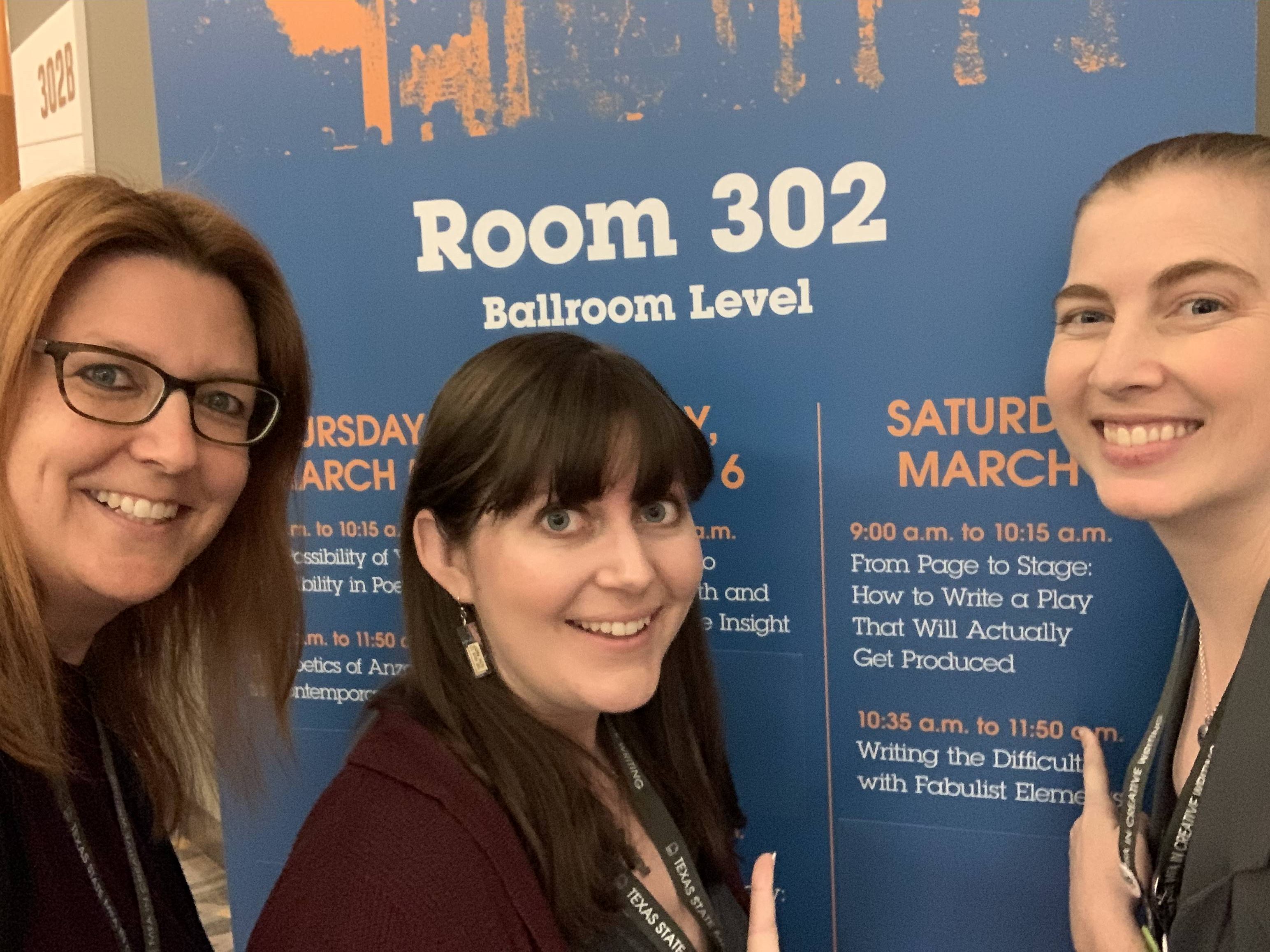 Annlee, Jessica, and Lauren outside of our panel room.