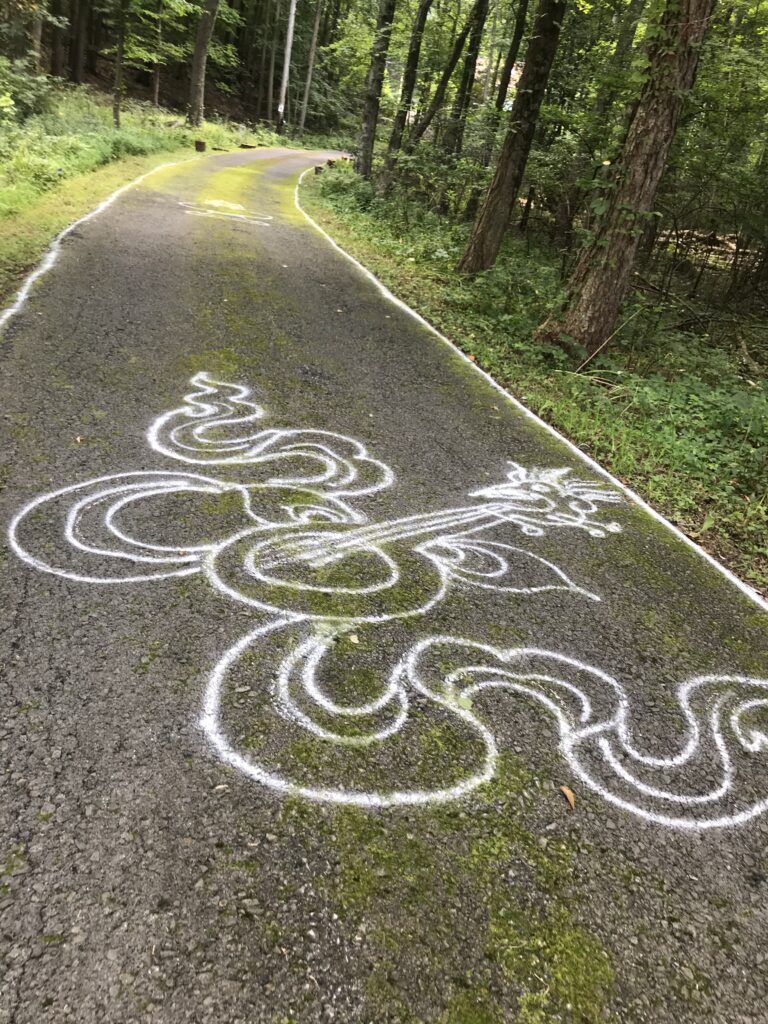 Edible Letters by Kathryn Stam, Figure 2. Chalk drawings of auspicious symbols line the entrance to the temple.