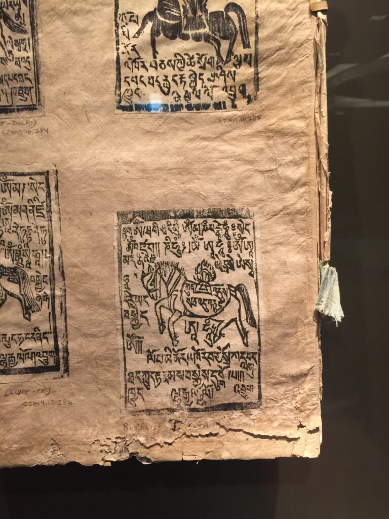 Edible Letters by Kathryn Stam,Figure 3. Tibetan Prayer Flags of Bön origin hanging at the Rubin Museum in New York City. 