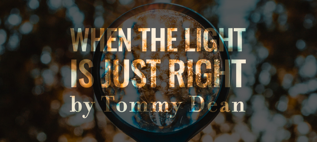 An image of a view through a microscope accompanies Tommy Dean's flash fiction 